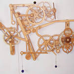 Want To Make Your Own Wicked-Looking Mechanical Wooden Clock?