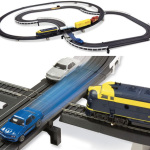 Miniature Accidents Waiting To Happen: Intersecting Slot Car And Train Set
